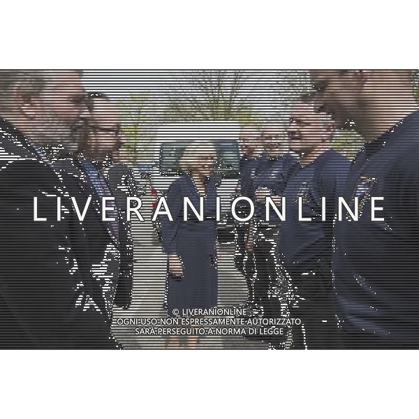 Camilla Duchess of Cornwall talks to members of her police outrider unit known as the \'Special Escort Group\' which is part of the metropolitan police. With her are the celebrity chefs known as the ñHairy Bikersî, Simon King and David Myers, who were with her on a visit to a Community Centre run by Elmbridge Borough Council in Cobham, Surrey. She also highlighted the the importance of the Elmbridge council\'s Meals on Wheels service. The \'Hairy biker\' chefs were there as part of their campaign to revive Meals on Wheels services for pensioners. The duchess also highligted the work being done by Surrey County Council in their Prevention Through Partnership Programme which arranges for services, like Meals on Wheels, to be made available to enable vulnerable people to live independently but with important support in their own homes. Pic: Richard Pohle ©PHOTOSHOT/AGENZIA ALDO LIVERANI SAS - ITALY ONLY - REALI INGLESI: Camilla Duchessa di Cornovaglia