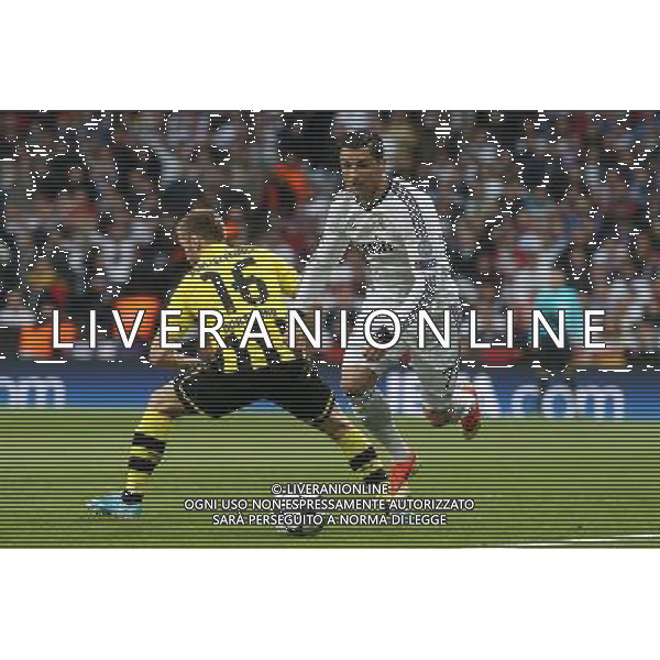 Real Madrid\'s Cristiano Ronaldo and Borussia Dortmund\'s Blaszcykowsky during Champions League match on april 30th 2013. Photo: Alex Cid-Fuentes / ALFAQUI AG ALDO LIVERANI S A S ONLY ITALY