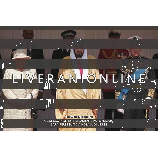 WINDSOR, ENGLAND - APRIL 30: Queen Elizabeth II and Prince Philip, the Duke of Edinburgh pose with The President of the United Arab Emirates, His Highness Sheikh Khalifa bin Zayed Al Nahyan on the Royal Dais on April 30, 2013 in Windsor, England. President Sheikh Khalifa begins a State visit to the UK today, the first for a UAE President in 24 years. Sheikh Khalifa will meet the British Prime Minister David Cameron tomorrow at his Downing Street residence. ©photoshot/AGENZIA ALDO LIVERANI SAS - ITALY ONLY - Il presidente degli Emirati Arabi Uniti Sua Altezza lo Sceicco Khalifa bin Zayed Al Nahyan incontra la regina Elisabetta II d\'inghilterra e del Principe Filippo a Windsor, durante una visita di Stato nel Regno Unito 30 aprile 2013