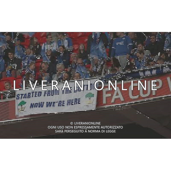 WIGAN FANS WITH SIGN MANCHESTER CITY V WIGAN ATHLETIC MANCHESTER CITY V WIGAN ATHLETIC. THE FA CUP FINAL 2013 WEMBLEY STADIUM, LONDON, ENGLAND, UK 11 May 2013 GAR68252 WARNING! This Photograph May Only Be Used For Newspaper And/Or Magazine Editorial Purposes. May Not Be Used For Publications Involving 1 player, 1 Club Or 1 Competition Without Written Authorisation From Football DataCo Ltd. For Any Queries, Please Contact Football DataCo Ltd on +44 (0) 207 864 9121 AG ALDO LIVERANI S A S ONLY ITALY