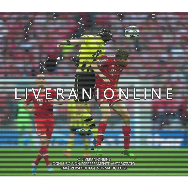 Bayern Munich\'s Thomas Muller goes up for a header with Borussia Dortmund\'s Neven Subotic (Photo by Chris Vaughan/CameraSport) Football - UEFA Champions League Final - Borussia Dortmund v Bayern Munich - Saturday 25th May 2013 - Wembley - London © CameraSport - 43 Linden Ave. Countesthorpe. Leicester. England. LE8 5PG - Tel: +44 (0) 116 277 4147 - admin@camerasport.com - www.camerasport.com AG ALDO LIVERANI S A S ONLY ITALY