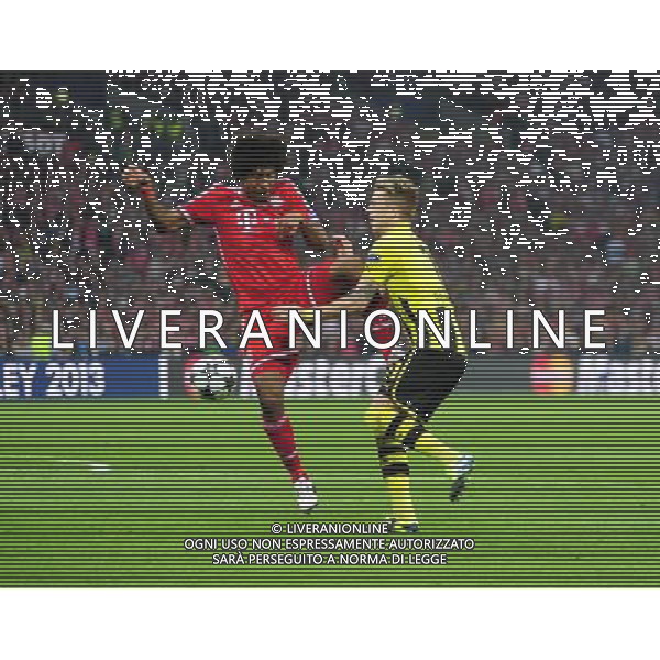 Borussia Dortmund\'s Marco Reus is fouled by Bayern Munich\'s Dante winning his side a penalty (Photo by Chris Vaughan/CameraSport) Football - UEFA Champions League Final - Borussia Dortmund v Bayern Munich - Saturday 25th May 2013 - Wembley - London © CameraSport - 43 Linden Ave. Countesthorpe. Leicester. England. LE8 5PG - Tel: +44 (0) 116 277 4147 - admin@camerasport.com - www.camerasport.com AG ALDO LIVERANI S A S ONLY ITALY