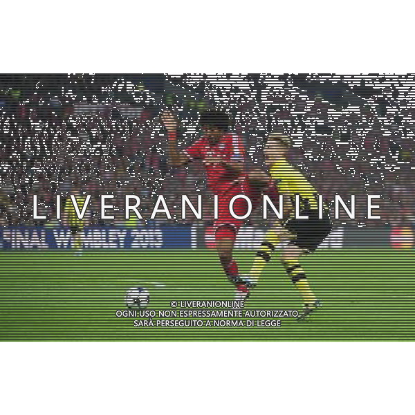 Borussia Dortmund\'s Marco Reus is fouled by Bayern Munich\'s Dante winning his side a penalty (Photo by Chris Vaughan/CameraSport) Football - UEFA Champions League Final - Borussia Dortmund v Bayern Munich - Saturday 25th May 2013 - Wembley - London © CameraSport - 43 Linden Ave. Countesthorpe. Leicester. England. LE8 5PG - Tel: +44 (0) 116 277 4147 - admin@camerasport.com - www.camerasport.com AG ALDO LIVERANI S A S ONLY ITALY
