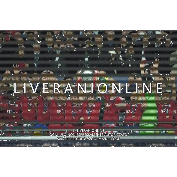 Bayern Munich\'s Philipp Lahm holds the Champions League trophy as he celebrates his team\'s win (Photo by Chris Vaughan/CameraSport) Football - UEFA Champions League Final - Borussia Dortmund v Bayern Munich - Saturday 25th May 2013 - Wembley - London © CameraSport - 43 Linden Ave. Countesthorpe. Leicester. England. LE8 5PG - Tel: +44 (0) 116 277 4147 - admin@camerasport.com - www.camerasport.com AG ALDO LIVERANI S A S ONLY ITALY