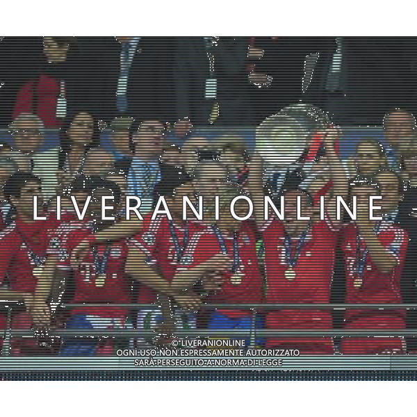 Bayern Munich\'s Franck Ribery holds the Champions League trophy as he celebrates his team\'s win (Photo by Chris Vaughan/CameraSport) Football - UEFA Champions League Final - Borussia Dortmund v Bayern Munich - Saturday 25th May 2013 - Wembley - London © CameraSport - 43 Linden Ave. Countesthorpe. Leicester. England. LE8 5PG - Tel: +44 (0) 116 277 4147 - admin@camerasport.com - www.camerasport.com AG ALDO LIVERANI S A S ONLY ITALY