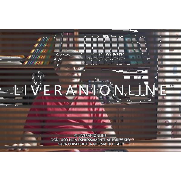 (130528) -- IRAKLIA, May 28, 2013 () -- Yiannis Gavalas, a principal of the only school in Iraklia island, Greece, sits in his office on May 22, 2013. For over 20 years, Gavalas has been working in this tiny island covers an area of 18 square kilometers with more than 100 residents. He has recorded about 650 species of plants, 174 species of birds and 26 species of butterflies in his spare time. He has published a book about local butterflies and more will follow. (/Liu Yongqiu) ©photoshot/AGENZIA ALDO LIVERANI SAS - ITALY ONLY - Il ricercaore Yiannis Gavalas, lavora nell\'isola di Iraklia, in Grecia, il 24 maggio 2013. Da oltre 20 anni, ha registrato circa 650 specie di piante, 174 specie di uccelli e 26 specie di farfalle