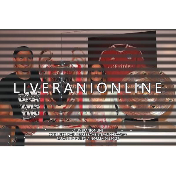 firo FuÃŸball,Fussball, 02.06.2013 DFB Pokalfeier FC Bayern MÃ¼nchen Pokalsieger Triple Sieger BERLIN, GERMANY - JUNE 01: Daniel van Buyten of FC Bayern Muenchen poses with Celine at the Champions League Winners trophy during the FC Bayern Muenchen Champions party after winning the German DFB Cup finale at Deutsche Telekom represantive house on June 1, 2013 in Berlin, Germany $worldrightsEs gelten unsere AGB, einsehbar auf www.firosportphoto.de Poolfoto copyright by firo sportphoto: Coesfelder StraÃŸe 207 48249 DÃ¼lmen Duelmen www.firosportphoto.de mail@firosportphoto.de (V o l k s b a n k B o c h u m - W i t t e n ) BLZ.: 430 601 29 Kt. Nr.: 341 117 100 Tel:Â  0209 - 9304402 Fax:Â  0209 - 9304443 AG ALDO LIVERANI S A S ONLY ITALY