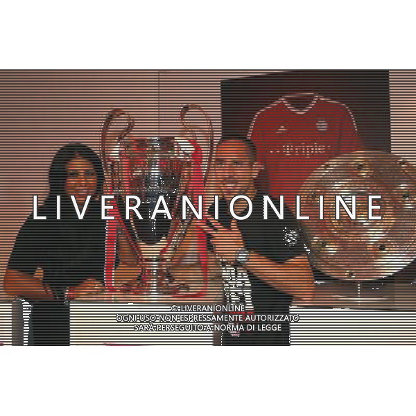 firo FuÃŸball,Fussball, 02.06.2013 DFB Pokalfeier FC Bayern MÃ¼nchen Pokalsieger Triple Sieger BERLIN, GERMANY - JUNE 01: Franck Ribery of FC Bayern Muenchen poses with Wahiba Belhami at the Champions League Winners trophy during the FC Bayern Muenchen Champions party after winning the German DFB Cup finale at Deutsche Telekom represantive house on June 1, 2013 in Berlin, Germany $worldrightsEs gelten unsere AGB, einsehbar auf www.firosportphoto.de Poolfoto copyright by firo sportphoto: Coesfelder StraÃŸe 207 48249 DÃ¼lmen Duelmen www.firosportphoto.de mail@firosportphoto.de (V o l k s b a n k B o c h u m - W i t t e n ) BLZ.: 430 601 29 Kt. Nr.: 341 117 100 Tel:Â  0209 - 9304402 Fax:Â  0209 - 9304443 AG ALDO LIVERANI S A S ONLY ITALY