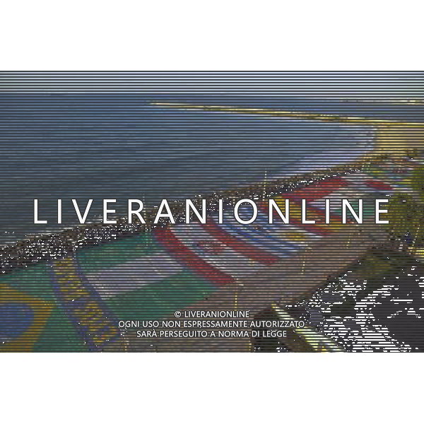 (130614) -- FORTALEZA, June 14, 2013 () -- People walk beside the flags that are part of the decor of Juninas Band Festival on Iracema Beach, in Fortaleza, state of Ceara, Brazil, on June 13, 2013. The festival is themed on this year FIFA Confederations Cup Brazil and a mosaic with the flags of all participating countries was assembled on Iracema Beach. The FIFA Confederations Cup Brazil 2013 will be held from June 15 to June 30 2013. (/AGENCIA ESTADO) (itm) (sp) ***BRAZIL OUT*** AG ALDO LIVERANI SAS ONLY ITALY
