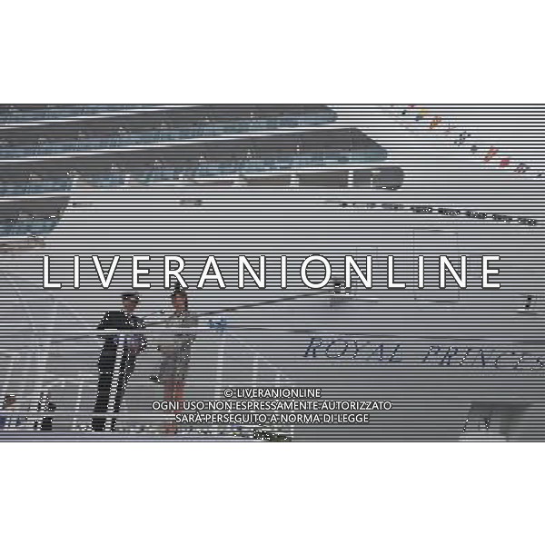 SOUTHAMPTON, ENGLAND - JUNE 13: Captain Tony Draper (L) watches as Catherine, Duchess of Cambridge speaks during the Princess Cruises ship naming ceremony at Ocean Terminal on June 13, 2013 in Southampton, England. AG ALDO LIVERANI SAS ONLY ITALY