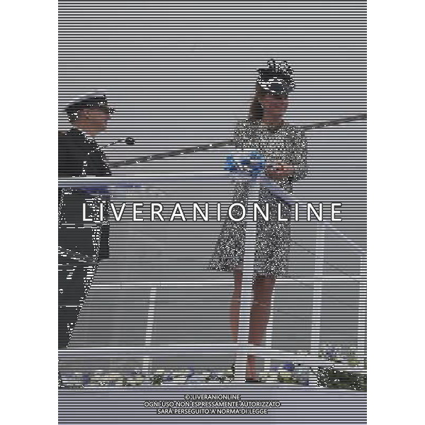 SOUTHAMPTON, ENGLAND - JUNE 13: Captain Tony Draper (L) watches as Catherine, Duchess of Cambridge cuts the ribbon during the Princess Cruises ship naming ceremony at Ocean Terminal on June 13, 2013 in Southampton, England. AG ALDO LIVERANI SAS ONLY ITALY