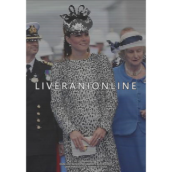 SOUTHAMPTON, ENGLAND - JUNE 13: Captain Tony Draper stands next to Catherine, Duchess of Cambridge (C) as she arrives for the Princess Cruises ship during its naming ceremony at Ocean Terminal on June 13, 2013 in Southampton, England. AG ALDO LIVERANI SAS ONLY ITALY