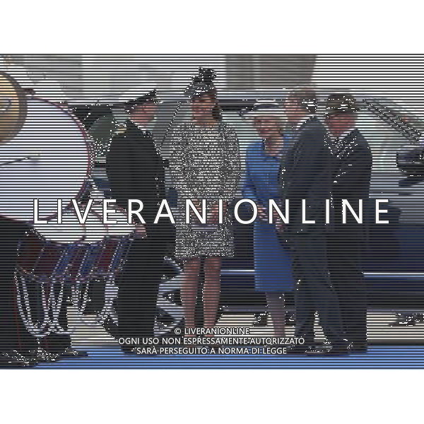 SOUTHAMPTON, ENGLAND - JUNE 13: Captain Tony Draper (L) greets Catherine, Duchess of Cambridge (2nd-L) as she arrives for the Princess Cruises ship naming ceremony at Ocean Terminal on June 13, 2013 in Southampton, England. AG ALDO LIVERANI SAS ONLY ITALY