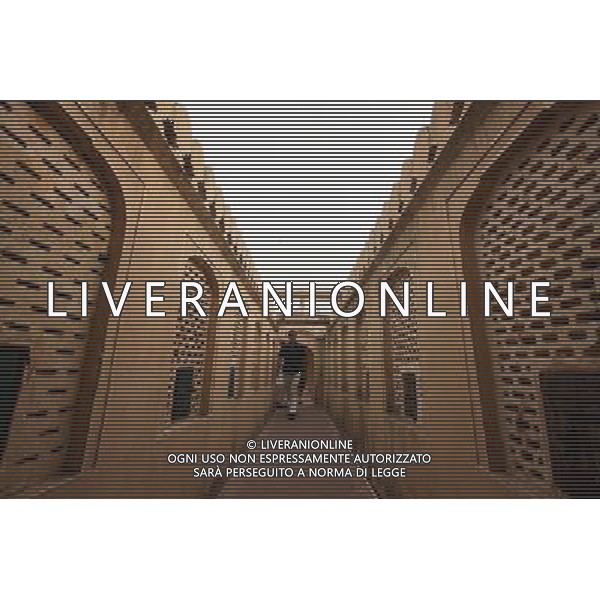 (130613) -- JAIPUR, June 13, 2013 () -- People visit the Hawa Mahal in Jaipur, capital of Rajasthan, India, June 13, 2013. The Hawa Mahal, also known as Palace of Winds, is a landmark palace in Jaipur. It was built in 1799 from red and pink sandstone with the intention to allow royal ladies to observe life outside the palace. The lattice on the wall was designed to prevent them from being seen, since they followed strict face cover rules. The Hawa Mahal\'s five-storey exterior has 953 small windows, which together with the lattice provides cool air during the high temperatures in summers. (/Zheng Huansong) ©Photoshot/AGENZIA ALDO LIVERANI SAS-ITALY ONLY - EDITORIAL USE ONLY