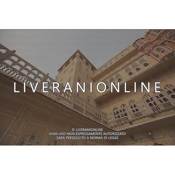 (130613) -- JAIPUR, June 13, 2013 () -- People visit the Hawa Mahal in Jaipur, capital of Rajasthan, India, June 13, 2013. The Hawa Mahal, also known as Palace of Winds, is a landmark palace in Jaipur. It was built in 1799 from red and pink sandstone with the intention to allow royal ladies to observe life outside the palace. The lattice on the wall was designed to prevent them from being seen, since they followed strict face cover rules. The Hawa Mahal\'s five-storey exterior has 953 small windows, which together with the lattice provides cool air during the high temperatures in summers. (/Zheng Huansong) ©Photoshot/AGENZIA ALDO LIVERANI SAS-ITALY ONLY - EDITORIAL USE ONLY