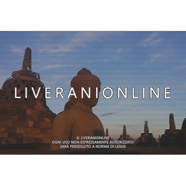 (130621) -- JAKARTA, June 21, 2013 () -- The photo taken on Dec. 20, 2012 shows the relics in the Borobudur Temple during sunrise in Central Java, Indonesia. Borobudur is a 9th-century Mahayana Buddhist Temple. It was listed as a UNESCO World Heritage Site in 1991 and confirmed as the largest temple in the world by the Guiness World Records in 2012. (/Jiang Fan) (dzl) ©Photoshot/AGENZIA ALDO LIVERANI SAS-ITALY ONLY - EDITORIAL USE ONLY