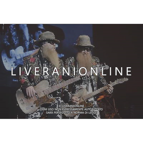 ZZ Top performing at Manchester Apollo on 25th June 2013. L-R: Dusty Hill, bass/vocals and Billy Gibbons lead guitar/vocals. ©photohsot/AGENZIA ALDO LIVERANI SAS - ITALY ONLY - EDITORIAL USE ONLY