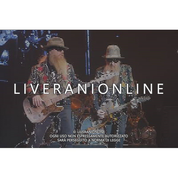 ZZ Top performing at Manchester Apollo on 25th June 2013. L-R: Dusty Hill, bass/vocals and Billy Gibbons lead guitar/vocals. ©photohsot/AGENZIA ALDO LIVERANI SAS - ITALY ONLY - EDITORIAL USE ONLY