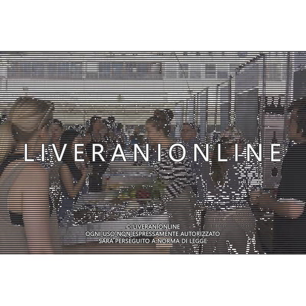 Customers shop at the New Amsterdam Market on South Street in New York on Sunday, June 23, 2013. The market is located in the former Fulton Fish Market with vendors who source their food directly from farmers and producers as well as the farms and makers of artisanal food. This year because of development of the South Street area the market will only open on one day with the organizers searching for a future permanent home. (Œ Richard B. Levine) ©photoshot/AGENZIA ALDO LIVERANI SAS - ITALY ONLY - Veduta della vita quotidiana e commerciale dei quartieri della citta\' di New York