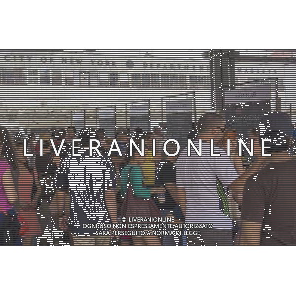 Customers shop at the New Amsterdam Market on South Street in New York on Sunday, June 23, 2013. The market is located in the former Fulton Fish Market with vendors who source their food directly from farmers and producers as well as the farms and makers of artisanal food. This year because of development of the South Street area the market will only open on one day with the organizers searching for a future permanent home. (Œ Richard B. Levine) ©photoshot/AGENZIA ALDO LIVERANI SAS - ITALY ONLY - Veduta della vita quotidiana e commerciale dei quartieri della citta\' di New York