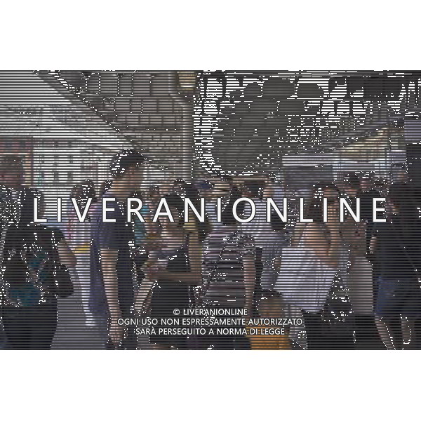 Customers shop at the New Amsterdam Market on South Street in New York on Sunday, June 23, 2013. The market is located in the former Fulton Fish Market with vendors who source their food directly from farmers and producers as well as the farms and makers of artisanal food. This year because of development of the South Street area the market will only open on one day with the organizers searching for a future permanent home. (Œ Richard B. Levine) ©photoshot/AGENZIA ALDO LIVERANI SAS - ITALY ONLY - Veduta della vita quotidiana e commerciale dei quartieri della citta\' di New York