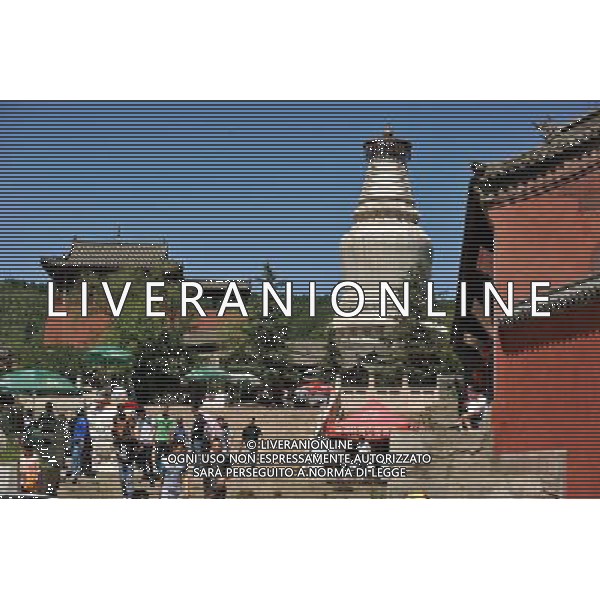 (130627) -- MOUNT WUTAI, June 27, 2013 () -- Tourists visit a temple on Mount Wutai, one of four sacred Buddhist mountains in China, in north China\'s Shanxi Province, June 26, 2013. Added to UNESCO\'s World Heritage List in 2009, Mount Wutai is home to about 50 Buddhist temples built between the 1st century AD and the early 20th century. (/Zhan Yan) (ry) ag aldo liverani sas only italy