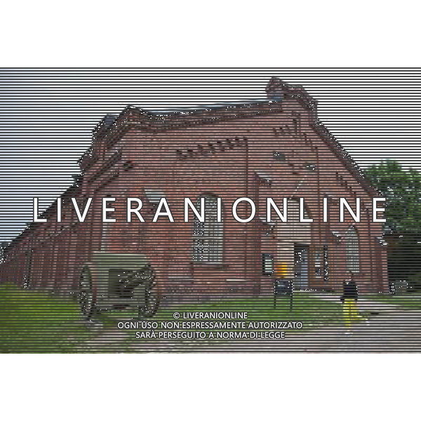 (130628) -- HELSINKI, June 28, 2013() -- A woman walks past the Military Museum of the island fortress of Suomenlinna in Helsinki, capital of Finland, on June 24, 2013. Fortress of Suomenlinna is a unique historical monument and one of the largest maritime fortresses in the world. Its construction began in 1700s when Finland was part of the Kingdom of Sweden. As an example of European military architecture of its time, Suomenlinna was included in UNESCO\'s World Heritage List in 1991. (/Yan Ting) AG ALDO LIVERANI SAS ONLY ITALY