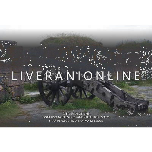 (130628) -- HELSINKI, June 28, 2013() -- Photo taken on June 24, 2013 shows a cannon on the coastal defense at the island fortress of Suomenlinna in Helsinki, capital of Finland. Fortress of Suomenlinna is a unique historical monument and one of the largest maritime fortresses in the world. Its construction began in 1700s when Finland was part of the Kingdom of Sweden. As an example of European military architecture of its time, Suomenlinna was included in UNESCO\'s World Heritage List in 1991. (/Yan Ting) AG ALDO LIVERANI SAS ONLY ITALY