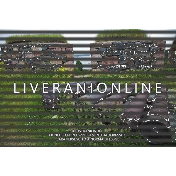 (130628) -- HELSINKI, June 28, 2013() -- Photo taken on June 24, 2013 shows artillery shells on the coastal defense at the island fortress of Suomenlinna in Helsinki, capital of Finland. Fortress of Suomenlinna is a unique historical monument and one of the largest maritime fortresses in the world. Its construction began in 1700s when Finland was part of the Kingdom of Sweden. As an example of European military architecture of its time, Suomenlinna was included in UNESCO\'s World Heritage List in 1991. (/Yan Ting) AG ALDO LIVERANI SAS ONLY ITALY