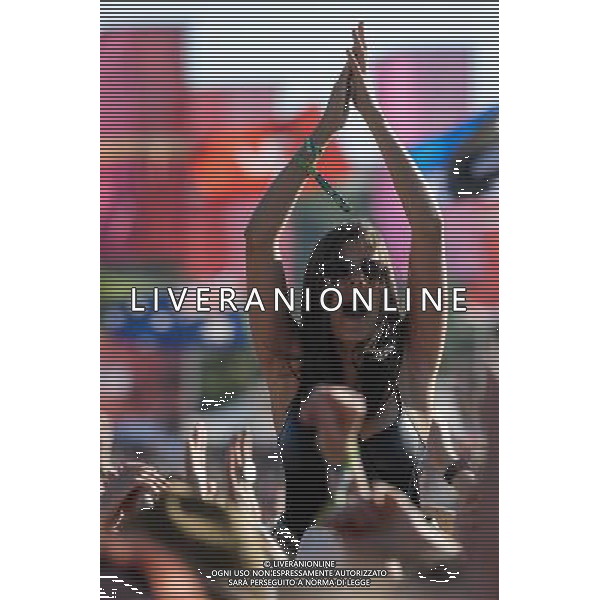Atmosphere at Glastonbury Festival on 27/06/2013 at Worthy Farm, Glastonbury. A woman high on shoulders enjoying herself clapping. ©PHOTOSHOT/AGENZIA ALDO LIVERANI SAS - ITALY ONLY - EDITORIAL USE ONLY