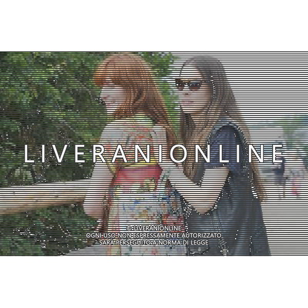Florence Welch with one of the Haim sisters at Glastonbury Festival, Worthy Farm, Pilton, Glastonbury, Somerset, UK on 28th June 2013. ©PHOTOSHOT/AGENZIA ALDO LIVERANI SAS - ITALY ONLY - EDITORIAL USE ONLY