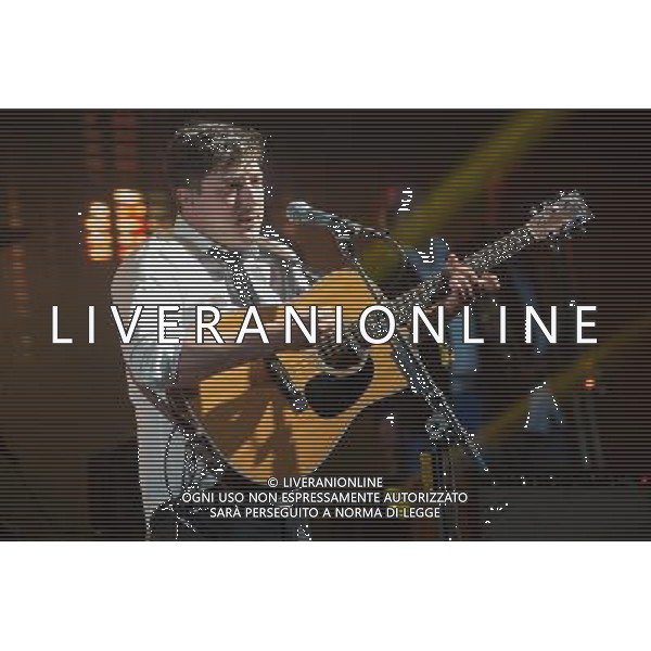 MumFord \' Sons headline the Pyramid Stage at Glastonbury Festival, Worthy Farm, Pilton, Glastonbury, Somerset, UK on 30th June 2013. The band consists of Marcus Mumford (lead vocals, guitar, drums, mandolin), Ben Lovett (vocals, keyboards, accordion, drums), Winston Marshall (vocals, banjo, guitar, resonator guitar), and Ted Dwane (vocals, string bass, drums, guitar). ©Photoshot/AGENZIA ALDO LIVERANI SAS-ITALY ONLY - EDITORIAL USE ONLY