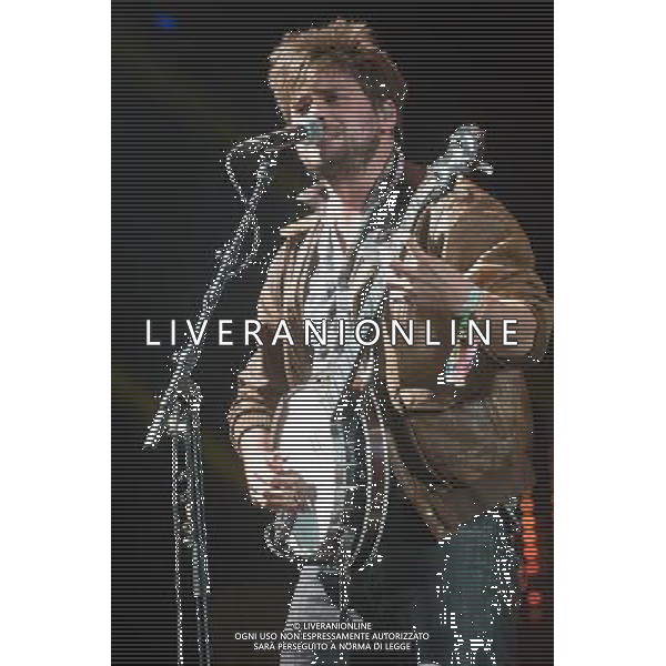 MumFord \' Sons headline the Pyramid Stage at Glastonbury Festival, Worthy Farm, Pilton, Glastonbury, Somerset, UK on 30th June 2013. The band consists of Marcus Mumford (lead vocals, guitar, drums, mandolin), Ben Lovett (vocals, keyboards, accordion, drums), Winston Marshall (vocals, banjo, guitar, resonator guitar), and Ted Dwane (vocals, string bass, drums, guitar). ©Photoshot/AGENZIA ALDO LIVERANI SAS-ITALY ONLY - EDITORIAL USE ONLY