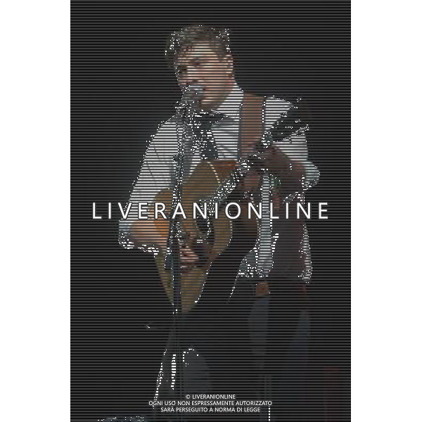 MumFord \' Sons headline the Pyramid Stage at Glastonbury Festival, Worthy Farm, Pilton, Glastonbury, Somerset, UK on 30th June 2013. The band consists of Marcus Mumford (lead vocals, guitar, drums, mandolin), Ben Lovett (vocals, keyboards, accordion, drums), Winston Marshall (vocals, banjo, guitar, resonator guitar), and Ted Dwane (vocals, string bass, drums, guitar). ©Photoshot/AGENZIA ALDO LIVERANI SAS-ITALY ONLY - EDITORIAL USE ONLY