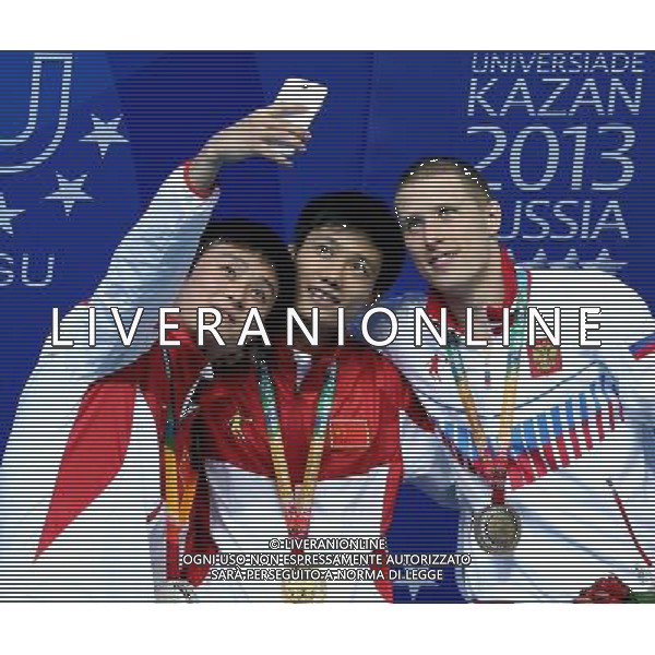 (130708) -- KAZAN, July 8, 2013 () -- China\'s Lin Jin (C), Qin Tian (L) and Russia\'s Evgenii Novoselov pose during the awarding ceremony for the men\'s 1m Springboard diving at the 27th Summer Universiade in Kazan, Russia, July 8, 2013. Lin Jin won the gold medal with 429.05. Qin Tian and Evgenii Novoselov took the second and third places respectively. (/Li Ying) AG ALDO LIVERANI SAS ONLY ITALY