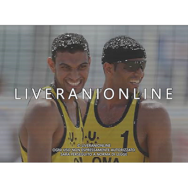(130709) -- KAZAN, July 9, 2013 () -- Al Belushi Hassan (R) and Al Subhi Faisal of Oman celebrate after winning men\'s beach volleyball match against China\'s Lin Minggui and Wang Dafa at the 27th Summer Universiade in Kazan, Russia, July 9, 2013. Al Belushi Hassan and Al Subhi Faisal won 2-0. (/Meng Yongmin) ©PHOTOSHOT/AGENZIA ALDO LIVERANI SAS - ITALY ONLY - EDITORIAL USE ONLY