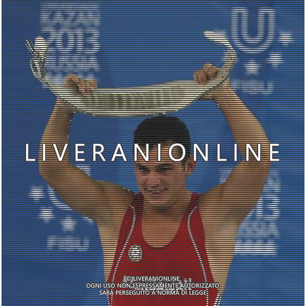 (130710) -- KAZAN, July 10, 2013 () -- Firidun Guliyev of Azerbaijan celebrates victory during the men\'s 69kg weightlifting final at the 27th Summer Universiade in Kazan Russia, July 9, 2013. Guliyev achieved the gold medal with 323kg in total. (/Li Ying) ©PHOTOSHOT/AGENZIA ALDO LIVERANI SAS - ITALY ONLY - EDITORIAL USE ONLY