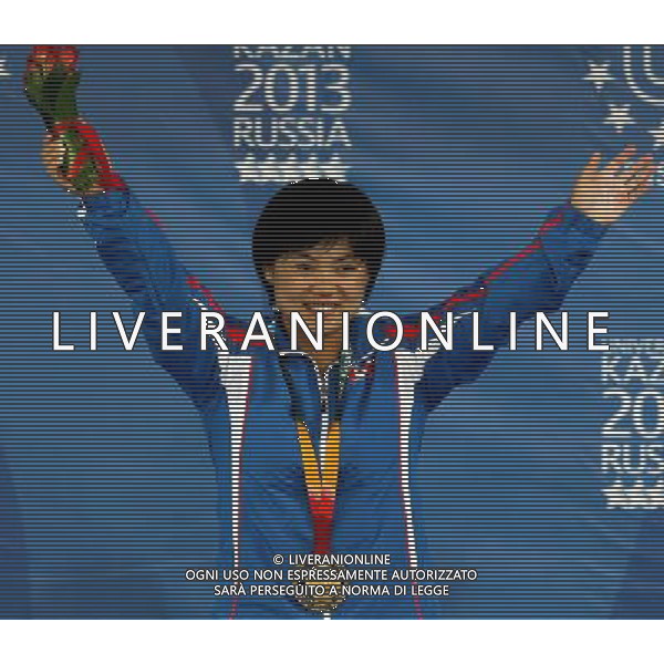 (130710) -- KAZAN, July 10, 2013 () -- Gold medalist Pyon Yong Mi of the Democratic People\'s Republic of Korea (DPRK) celebrates victory during the awarding ceremony of women\'s 63kg weightlifting at the 27th Summer Universiade in Kazan, Russia, July 9, 2013. Pyon Yong Mi claimed the title with 233kg in total. (/Li Ying) ©PHOTOSHOT/AGENZIA ALDO LIVERANI SAS - ITALY ONLY - EDITORIAL USE ONLY