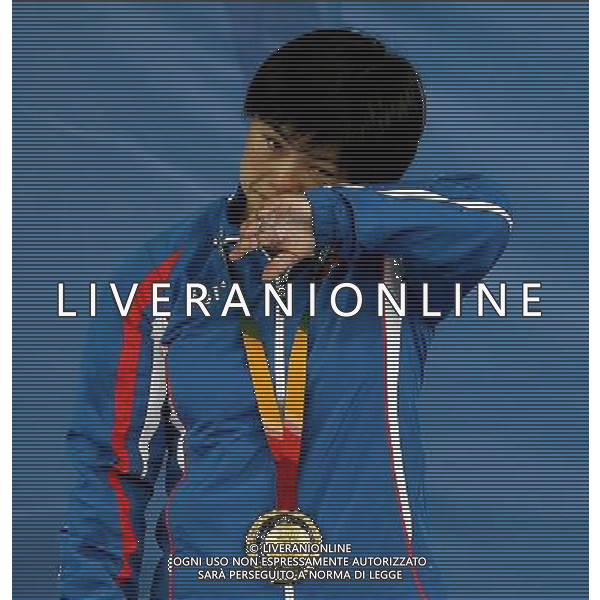(130710) -- KAZAN, July 10, 2013 () -- Gold medalist Pyon Yong Mi of the Democratic People\'s Republic of Korea (DPRK) cries during the awarding ceremony of women\'s 63kg weightlifting at the 27th Summer Universiade in Kazan, Russia, July 9, 2013. Pyon Yong Mi claimed the title with 233kg in total. (/Li Ying) ©PHOTOSHOT/AGENZIA ALDO LIVERANI SAS - ITALY ONLY - EDITORIAL USE ONLY