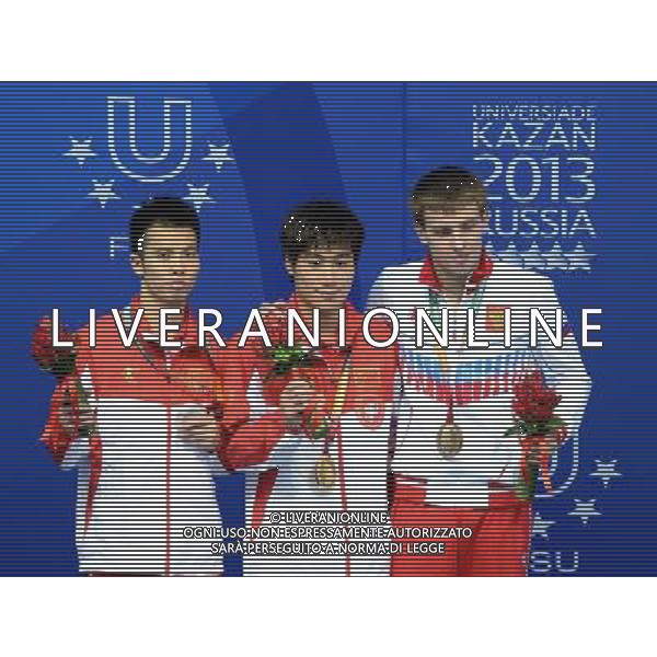 (130710) -- KAZAN, July 10, 2013 () -- China\'s Huo Liang (C), Wu Jun (L) and Russia\'s Minibaev pose during the awarding ceremony for the men\'s 10m platform diving at the 27th Summer Universiade in Kazan, Russia, July 10, 2013. Huo Liang won the gold medal with 531.25. (/Kong Hui) ©photoshot/AGENZIA ALDO LIVERANI SAS - ITALY ONLY - EDITORIAL USE ONLY