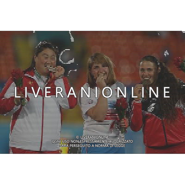 (130712) -- KAZAN, July 12, 2013 () -- Gold medalist Irina Tarasova (C) of Russia poses with silver medalist Liu Xiangrong (L) of China and Natalia Duco of Chile during the awarding ceremony after the women\'s shot put final at the 27th Summer Universiade in Kazan, Russia, July 11, 2013. Tarasova won the gold medal with 18.75 meters. (/Meng Yongmin) (jyc) ©photoshot/AGENZIA ALDO LIVERANI SAS - ITALY ONLY - EDITORIAL USE ONLY