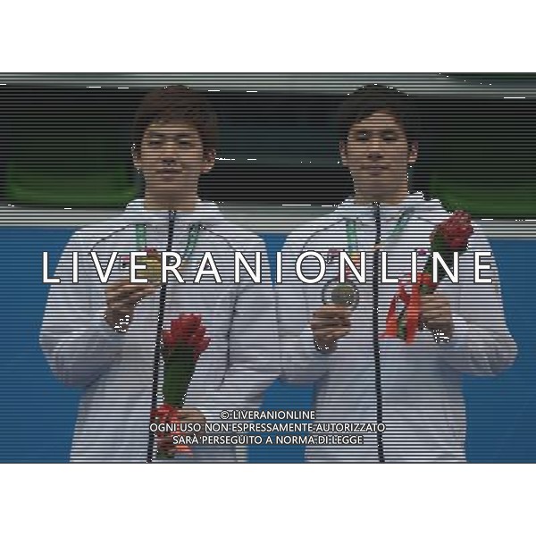 (130712) -- KAZAN, July 12, 2013 () -- Lee Yong Dae (L) and Ko Sung Hyun of South Korea pose during the awarding ceremony after the men\'s doubles final match of badminton event against Ivan Sozonov and Vladimir Ivanov of Russia at the 27th Summer Universiade in Kazan, Russia, July 11, 2013. Lee Yong Dae and Ko Sung Hyun won the gold medal with 3-0. (/Kong Hui) (jyc) ©photoshot/AGENZIA ALDO LIVERANI SAS - ITALY ONLY - EDITORIAL USE ONLY