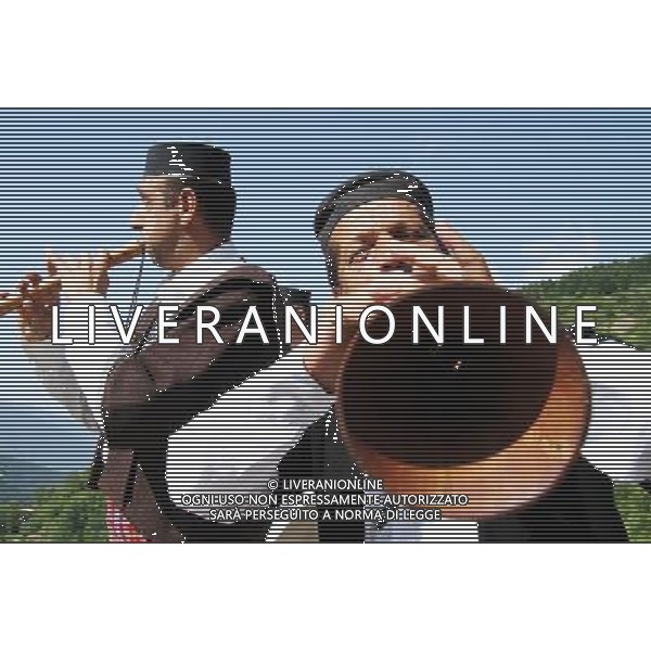 (130714) -- SKOPJE, July 14, 2013 () -- Musicians perform on a traditional Macedonian instrument called \'zurla\' while following the groom\'s friends as part of the traditional wedding ceremony in the village of Galicnik, Macedonia, on July 14, 2013. The western Macedonian village of Galicnik staged its traditional wedding ceremony, an annual event that has been running for more than 50 years. (/Darko Duridanski) ©photoshot/AGENZIA ALDO LIVERANI SAS - ITALY ONLY - Cerimonia tradizionale di nozze e matrimoni macedone con processione nel villaggio di Galicnik, in Macedonia, il 14 luglio 2013.