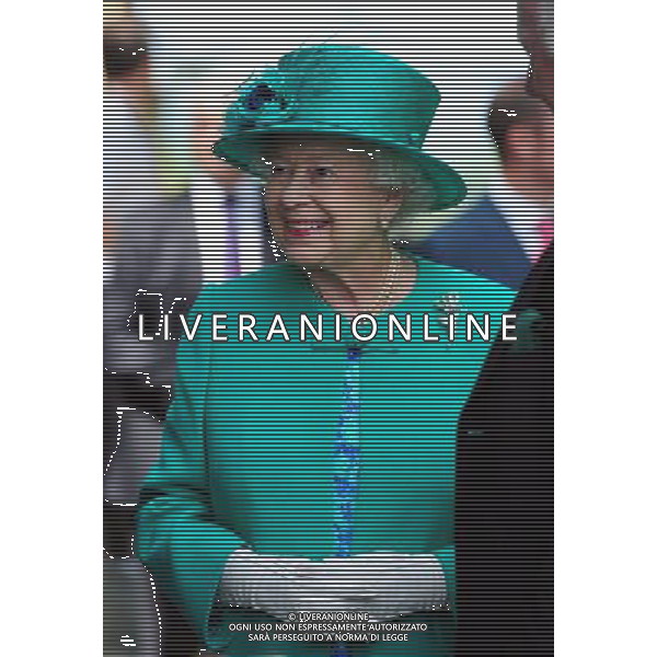 Queen Elizabeth II smiles during her trip to Bowness on Windermere, Cumbria. The Queen said today that she is hoping the royal baby is born soon - because she is about to go on holiday. She made the comment in reply to a question from a 10-year-old schoolgirl while on a series of engagements in the Lake District. ©photoshot/AGENZIA ALDO LIVERANI SAS - ITALY ONLY - REALI INGLESI: La Regina Elisabetta II d\'inghilterra in visita al lago di Windermere, Cumbria