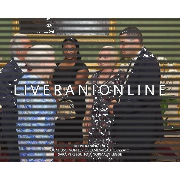 Queen Elizabeth II meets Grand Mentor Judith Philip (second from right) and mentee Hakeem Ranger (right) at a reception to commemorate the fiftieth anniversary of Community Service Volunteers, at St James\'s Palace, in central London. ©photoshot/AGENZIA ALDO LIVERANI SAS - ITALY ONLY - REALI INGLESI: La Regina Elisabetta II d\'inghiletrra riceve i membri del volontariato nel cinquantesimo anniversario del Servizio Comunita\' Volontari, presso il Palazzo di San Giacomo, nel centro di Londra.