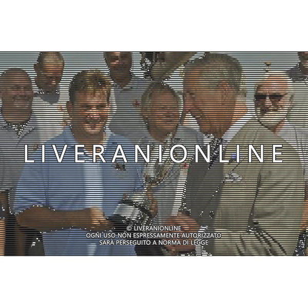 The Prince of Wales presents the King George V Cup to the crew aboard the Pilgrim, which is a restored fishing trawler, as the royal party are shown around heritage fishing vessels at Brixham Marina in the Devonshire fishing port of Brixham as the Duchess and the Prince take part in their annual summer visit to Cornwall and Devon. ©photoshot/AGENZIA ALDO LIVERANI SAS - ITALY ONLY - REALI INGLESI : Il principe Carlo d\'inghiletrra con la moglie Camilla al West Country durante la loro visita estiva annuale in Cornovaglia e Devon.