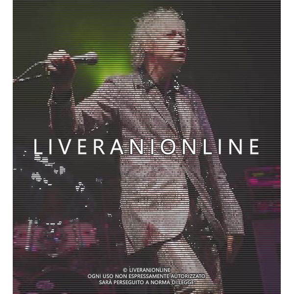 Bob Geldof performs in a fake crocodile skin suit with the Boomtown Rats at Chagstock, a small music festival near Okehampton, Devon. 20 July 2013 ©photoshot/AGENZIA ALDO LIVERANI SAS - ITALY ONLY - EDITORIAL USE ONLY