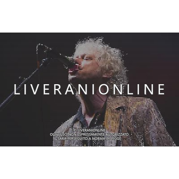 Bob Geldof performs in a fake crocodile skin suit with the Boomtown Rats at Chagstock, a small music festival near Okehampton, Devon. 20 July 2013 ©photoshot/AGENZIA ALDO LIVERANI SAS - ITALY ONLY - EDITORIAL USE ONLY
