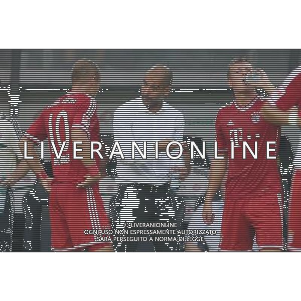 firo FuÃŸball,Fussball, 27.07.2013 1.Bundesliga, Saison 2013/2014 Supercup Finale BVB Borussia Dortmund - FC Bayern MÃ¼nchen Guardiola mit Robben $worldrightsEs gelten unsere AGB, einsehbar auf www.firosportphoto.de copyright by firo sportphoto: Coesfelder Str.207 48249 DÃ¼lmen www.firosportphoto.de mail@firosportphoto.de (V o l k s b a n k B o c h u m - W i t t e n ) BLZ.: 430 601 29 Kt. Nr.: 341 117 100 Tel:Â  02594 - 9916004 Fax:Â 02594 - 9916005 AG ALDO LIVERANI SAS ONLY ITALY