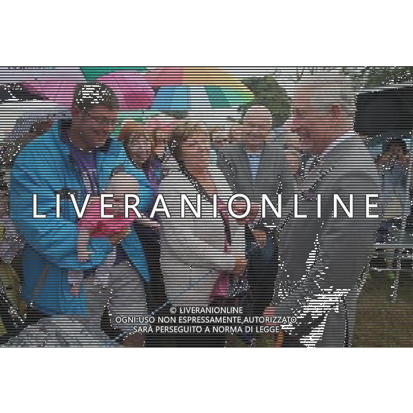 KING\'S LYNN, ENGLAND - JULY 31: Prince Charles, Prince of Wales meets members of the public during a visit to the 132nd Sandringham Flower Show at Sandringham House on July 31, 2013 in King\'s Lynn, England. ©photoshot/AGENZIA ALDO LIVERANI SAS - ITALY ONLY - REALI INGLESI: Il principe Carlo d\'inghilterra con la moglie Camilla duchessa di Cornovaglia
